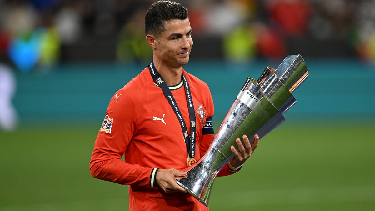 File : Portugal's Cristiano Ronaldo celebrates with the UEFA Nations League 2024-25 trophy.