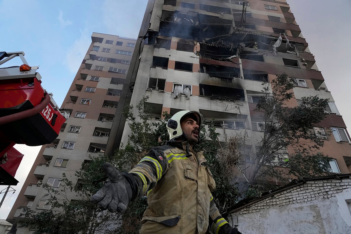 AP Photo/Vahid Salemi : A firefighter in Tehran where Israel air-striked on June 13,2025| REP IMAGE |