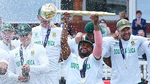 AP : South Africa captain Temba Bavuma holds the winners trophy and celebrates with teammates after their win in the ICC World Test Championship 2025 final against Australia at Lords.