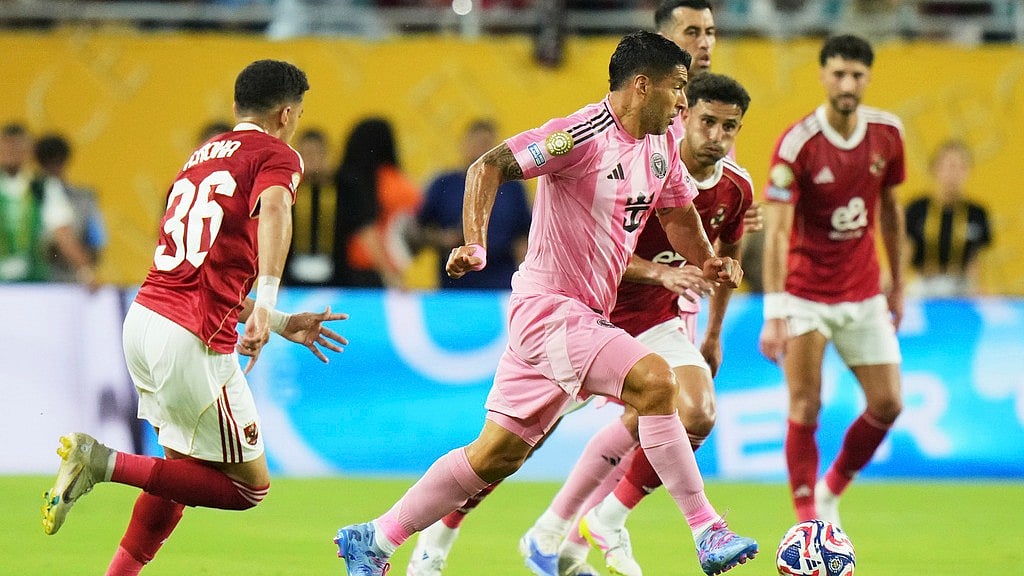 AP/Lynne Sladky : Inter Miami's Luis Suarez, centre, runs from Al Ahly's Ahmed Nabil Koka, left, during the Club World Cup group A soccer match.