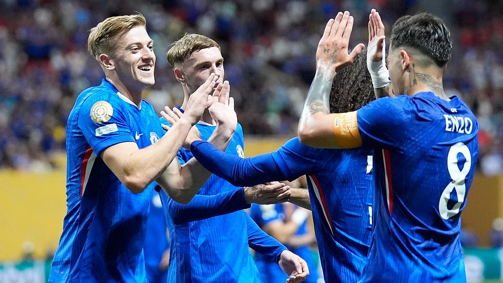 Photo: AP : Chelsea's Enzo Fernandez, right, is congratulated by teammates after scoring his side's second goal against Los Angeles FC during the FIFA Club World Cup.