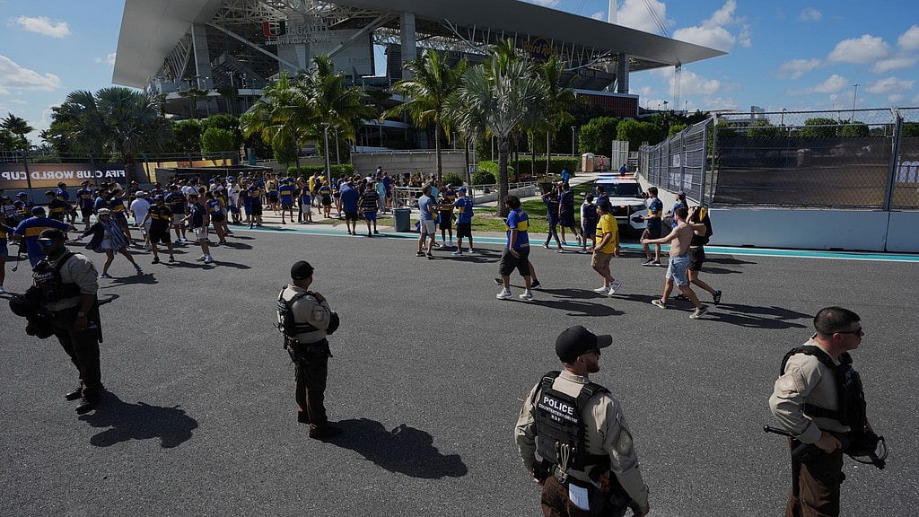 AP/Rebecca Blackwell : Law enforcement personnel stand outside the stadium prior to the Club World Cup group C soccer match between Boca Juniors and Benfica in Miami Gardens.
