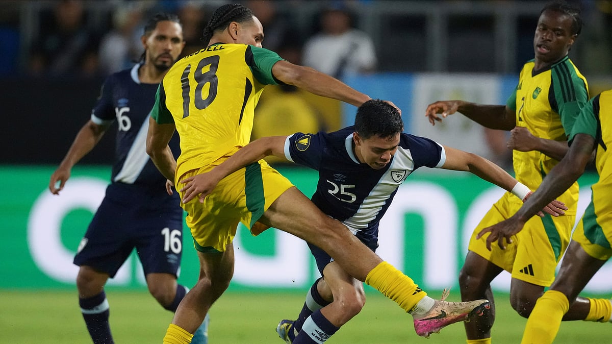 | Photo: AP/Jae C. Hong : Jamaica vs Guadeloupe, Concacaf Gold Cup 2025: Kevin Ramirez is tangled up with Jamaica midfielder Jonathan Russell during the second half of a CONCACAF Gold Cup soccer match Monday, June 16, 2025, in Carson, Calif.