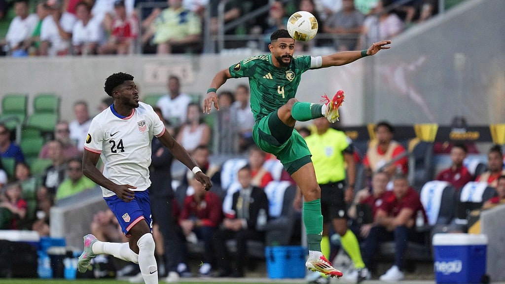 AP/Eric Gay : Saudi Arabia's Abdulelah Alamri (4) moves the ball past United States' Patrick Agyemang (24) during a CONCACAF Gold Cup soccer match.