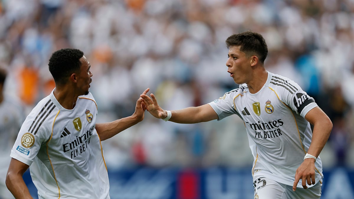(AP Photo/Nell Redmond) : Real Madrid's Arda Guler, right, and Real Madrid's Trent Alexander-Arnold celebrate after a goal during the Club World Cup Group H soccer match between Real Madrid and CF Pachuca in Charlotte, N.C., Sunday, June 22, 2025.