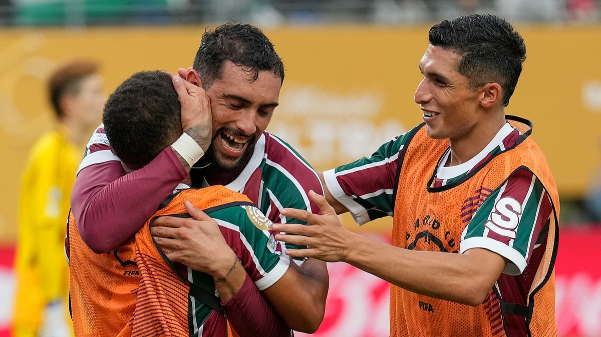 (AP Photo/Seth Wenig) : Fluminense's Juan Pablo Freytes, center, celebrates with teammates after scoring a goal against Ulsan HD during the second half of a Club World Cup group F soccer match, Saturday, June 21, 2025, in East Rutherford, N.J.