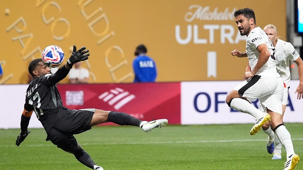 AP : Manchester City's lkay Gundogan, right, scores his side's fourth goal against Al Ain during the Club World Cup Group G soccer match between Manchester City and Al Ain in Atlanta, Sunday, June 22, 2025.