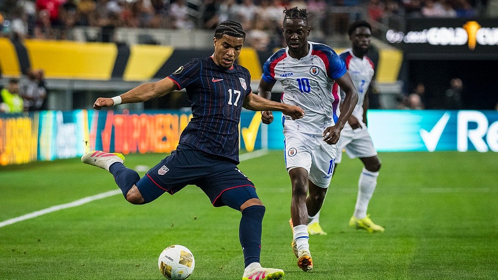 Photo: AP : United States forward Malik Tillman (17) crosses the ball during their Concacaf Gold Cup match against Haiti in Arlington, Texas.