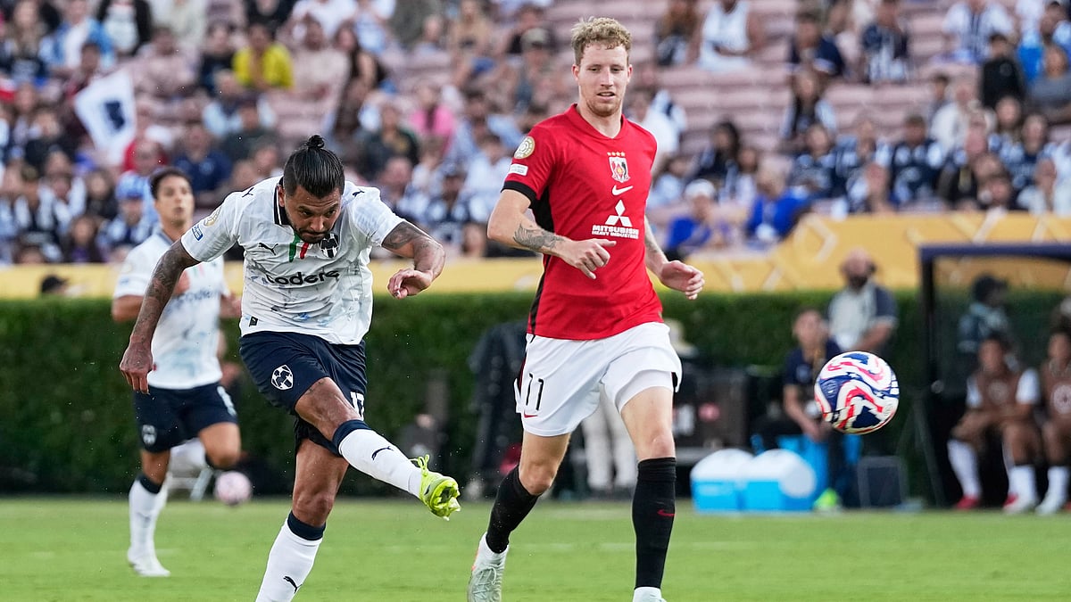 AP Photo/Gregory Bull : Monterrey's Jesus Manuel Corona scores past Urawa Red Diamonds' Samuel Gustafson during the Club World Cup Group E football match between Urawa Red Diamonds and CF Monterrey in Pasadena.