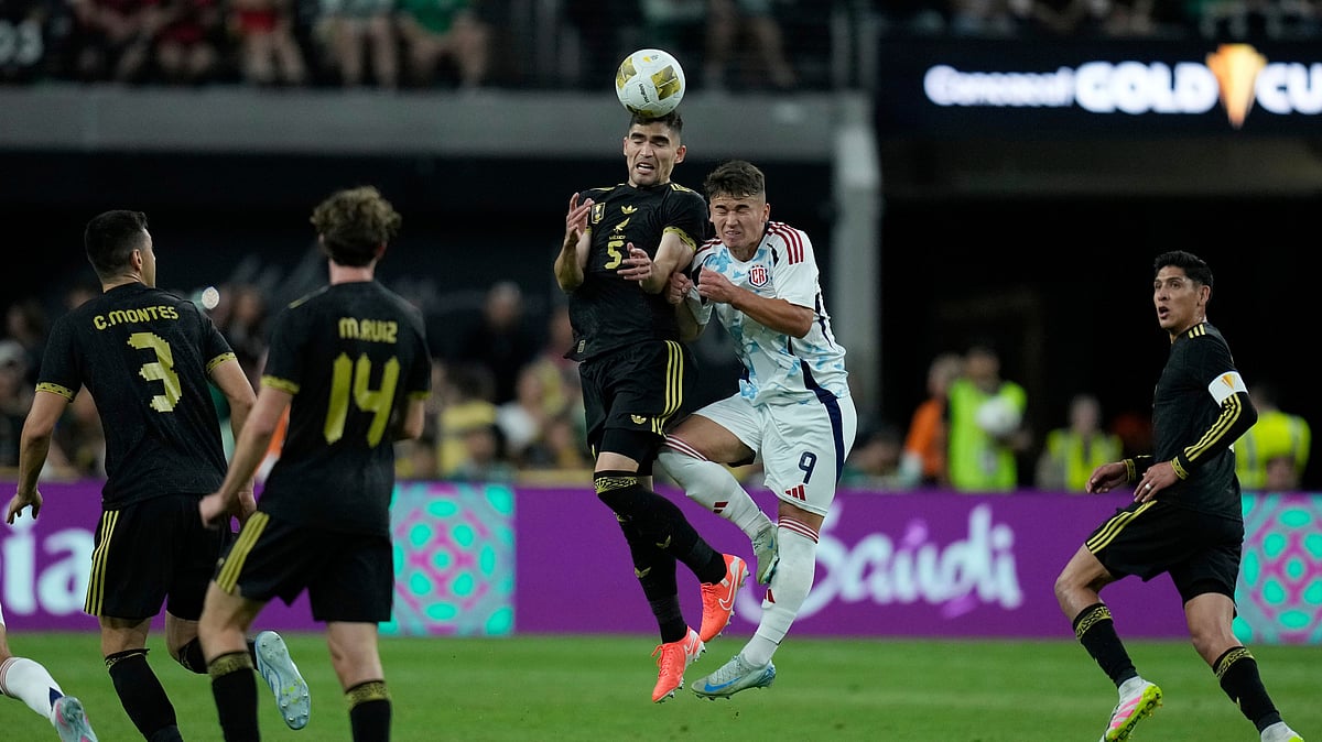 AP Photo/John Locher : Mexico's Johan Vasquez (5) heads the ball over Costa Rica's Manfred Ugalde (9) during a CONCACAF Gold Cup football match Sunday, June 22, 2025, in Las Vegas.