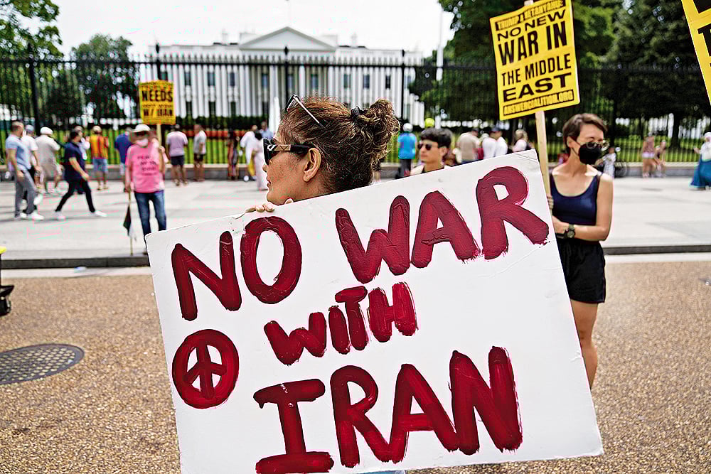 Photo: AP : A New War: Demonstrators rally outside the White House in Washington to protest the US military strike on three nuclear sites in Iran