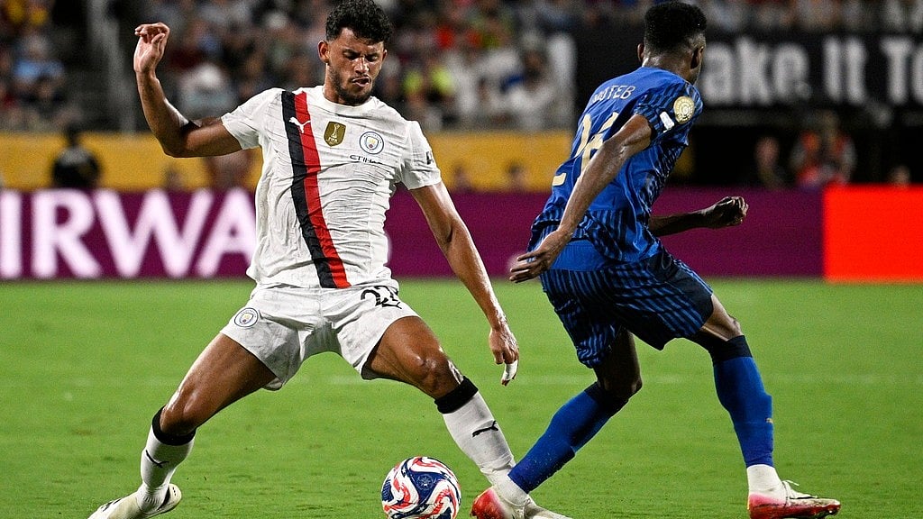 AP : Manchester City's Matheus Nunes and Al-Hilal's Moteb Al-Harbi battle during the Club World Cup round of 16 soccer match between Manchester City and Al Hilal in Orlando.