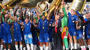 | Photo: AP/Jacquelyn Martin : Chelsea vs PSG, FIFA Club World Cup 2025: President Donald Trump, sixth from right, watches as Chelsea's Reece James (24) lifts the trophy following the Club World Cup final soccer match between Chelsea and PSG at MetLife Stadium in East Rutherford, N.J., Sunday, July 13, 2025.