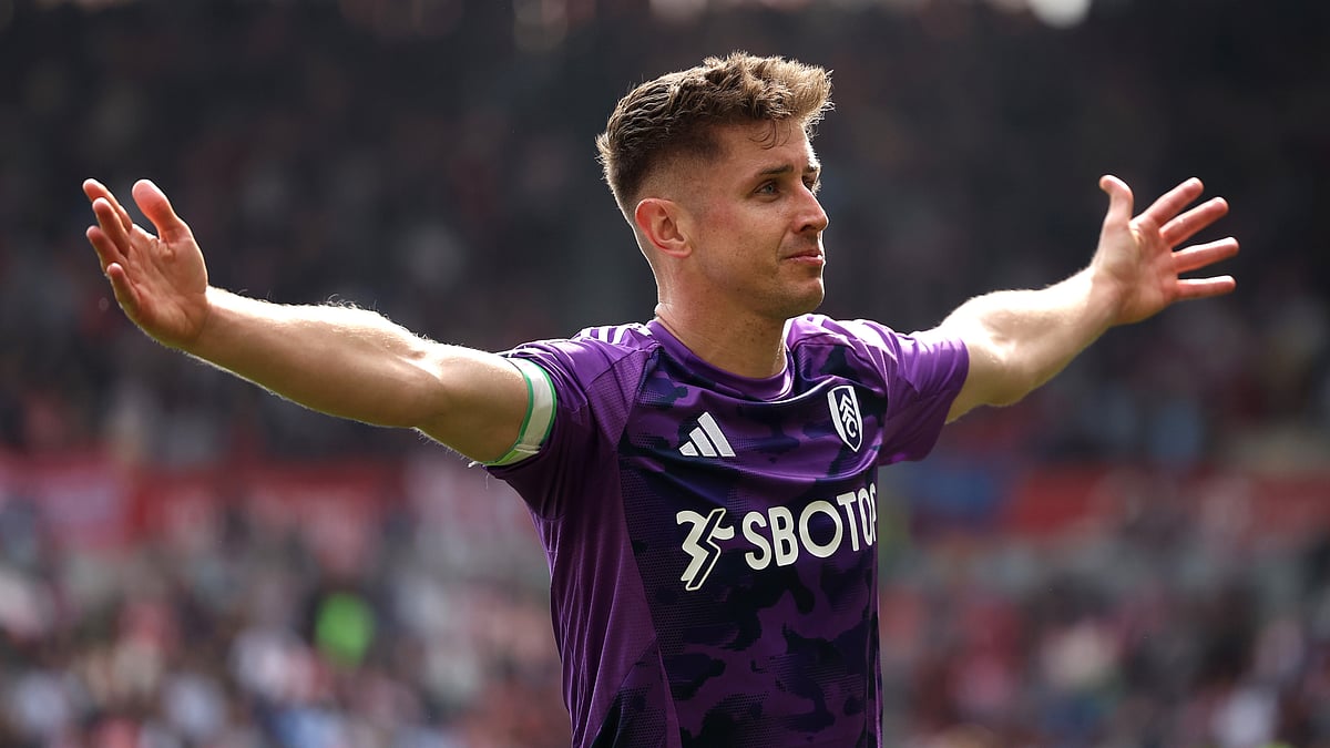 Tom Cairney celebrates after scoring against Brentford in May