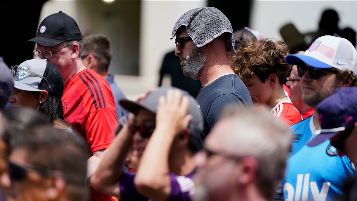 (AP Photo/Erik Verduzco, File) : FILE - Soccer fans wait in line to enter Bank of America Stadium for a Club World Cup game, June 24, 2025, in Charlotte, N.C. 