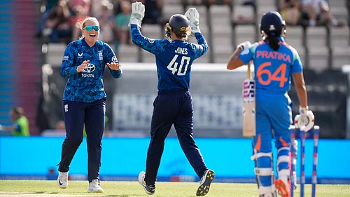 | Photo: AP/Andrew Matthews : Englands Sophie Ecclestone, left, celebrates with Amy Jones after taking the wicket of Indias Pratika Rawal (64) during the fifth womens cricket IT20 at the Utilita Bowl, Southampton, England, Wednesday July 16, 2025.