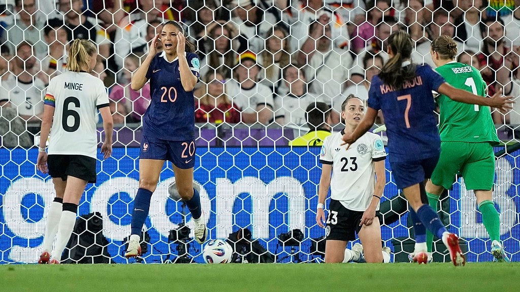 AP/Martin Meissner : France's Delphine Cascarino, 2nd left, reacts after scoring a goal that was disallowed for an off side during the Women's Euro 2025 quarterfinals soccer match.