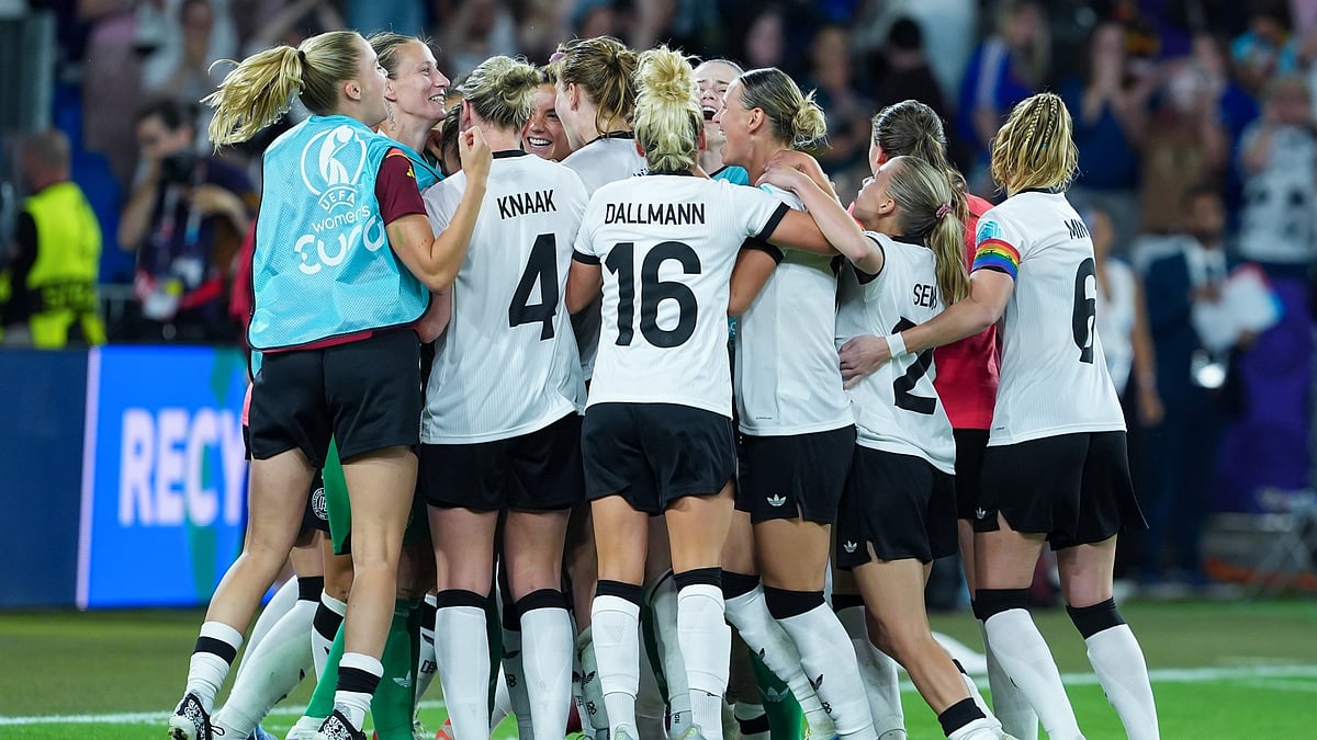 File : Germany celebrate their shootout win over France.