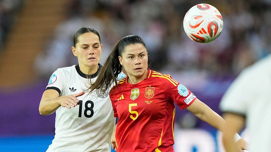 AP : Germany's Giovanna Hoffmann, left, challenges Spain's Maria Mendez during the Women's Euro 2025 semifinals soccer match between Germany and Spain at Stadion Letzigrund in Zurich, Switzerland