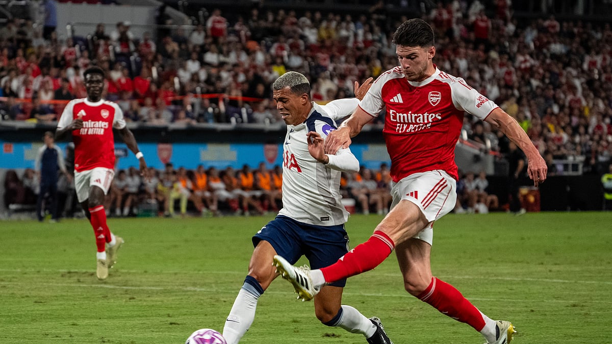 AP Photo/Chan Long Hei : Arsenal's Declan Rice, right, takes a shot during the first North London Derby played outside the United Kingdom between Arsenal FC and Tottenham Hotspur at the Hong Kong Football Festival held at the Kai Tak Stadium in Hong Kong.