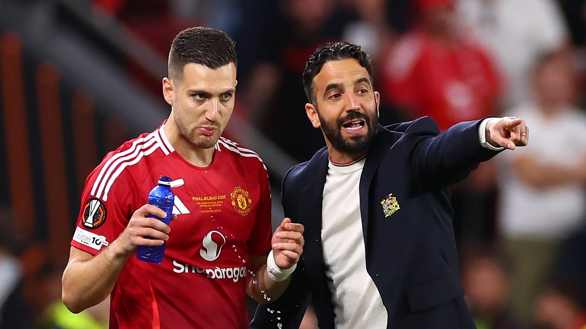 Manchester United right-back Diogo Dalot with head coach Ruben Amorim