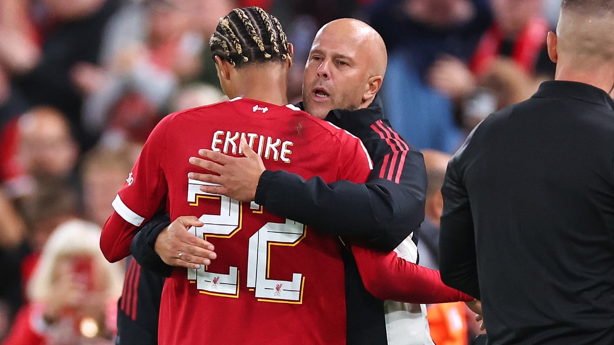 Ekitike and Slot embrace during Liverpool's clash with Bilbao