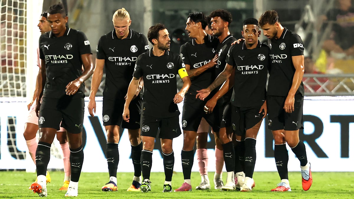 Tijjani Reijnders celebrates with his Manchester City team-mates