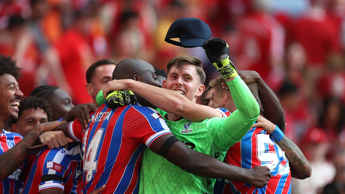 Crystal Palace's Dean Henderson celebrates after sealing the penalty win for his side.