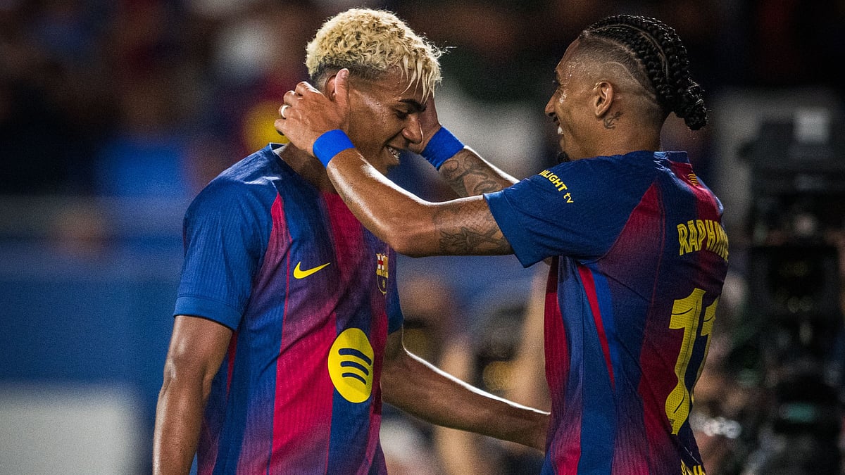 X/FCBarcelona : Lamine Yamal (left)) and Raphinha celebrate a goal.