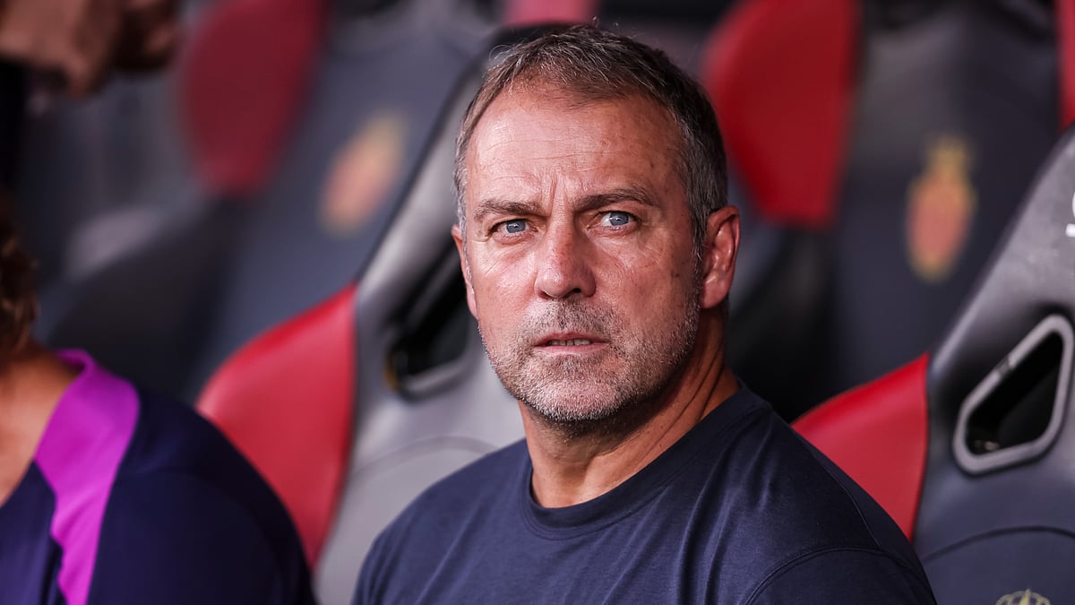 Hansi Flick looks on during Barcelona's win over Mallorca.