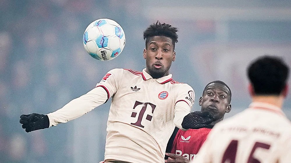 | Photo: AP/Martin Meissner : Bundesliga 2024-25: Kingsley Coman challenges for the ball with Leverkusen's Nordi Mukiele.