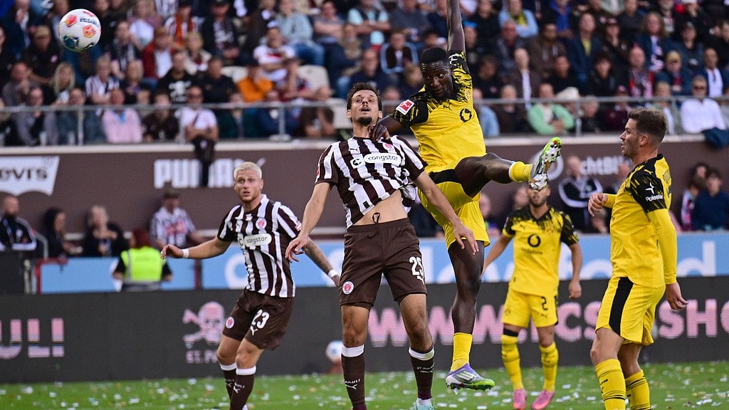 Photo: AP : St Pauli Vs Borussia Dortmund Highlights, Bundesliga: Adam Dzwigala, centre, and Serhou Guirassy, fight for the ball.