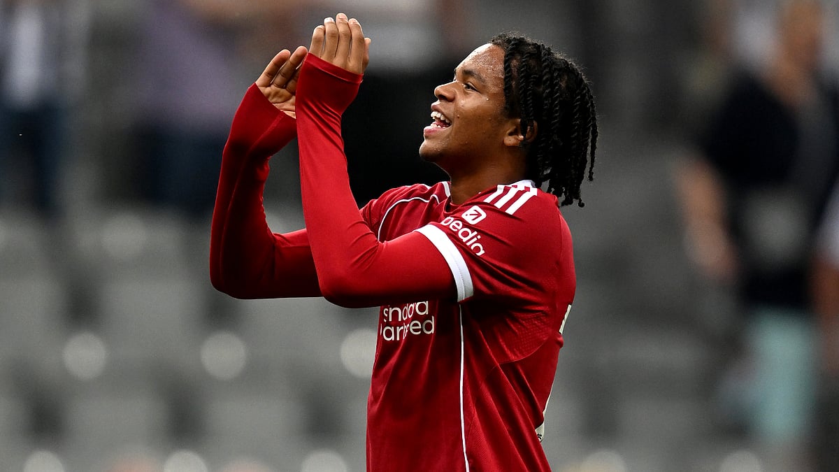 Rio Ngumoha applauds the Liverpool fans.