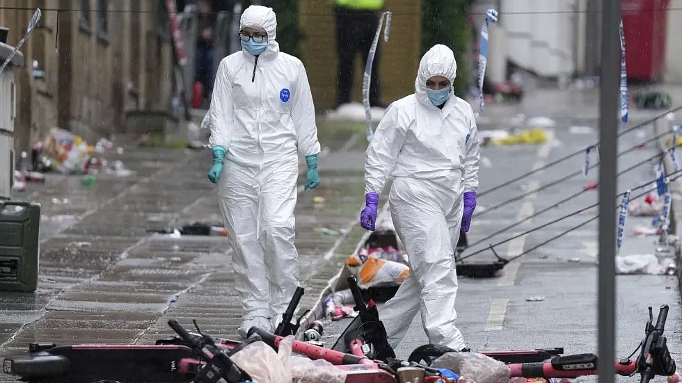 | Photo: AP/Jon Super : Forensic officers examine the site where a 53-year-old British man plowed a minivan into a crowd of Liverpool soccer fans who were celebrating the city’s Premier League championship Monday, injuring more than 45 people in Liverpool, England, Tuesday, May 27, 2025.