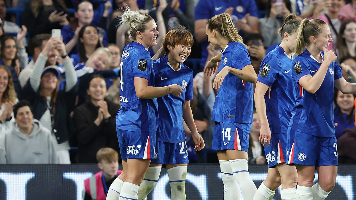 Maika Hamano celebrates with her Chelsea team-mates after scoring against Manchester City