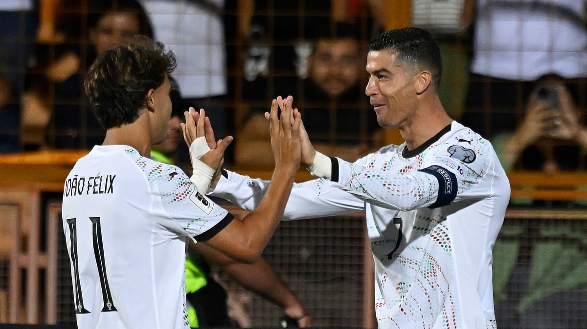 (AP Photo/Hakob Berberyan) : Portugal's Cristiano Ronaldo, right, celebrates with Joao Felix after scoring his side's fourth goal during a World Cup 2026 group F qualifying soccer match between Armenia and Portugal at the Vazgen Sargsyan stadium in Yerevan, Armenia, Saturday, Sept. 6, 2025.