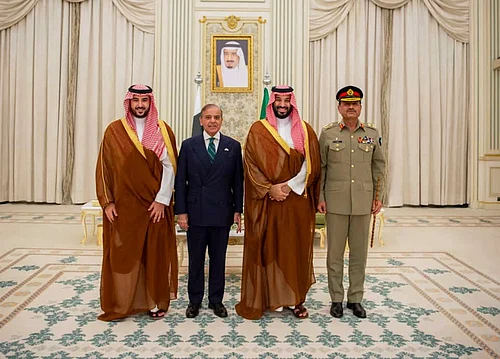 Press Information Department via AP : In this photo released by Pakistans Press Information Department, Saudi Arabias Crown Prince Mohammed bin Salman, second right, Saudi Arabias Defence Minister Khalid bin Salman, left, Pakistans Prime Minister Shehbaz Sharif, second left, and Pakistans Army Chief Field Marshal Asim Munir, pose for photographs after signing a mutual defense pact, in Riyadh, Saudi Arabia, Wednesday, Sept. 17, 2025.