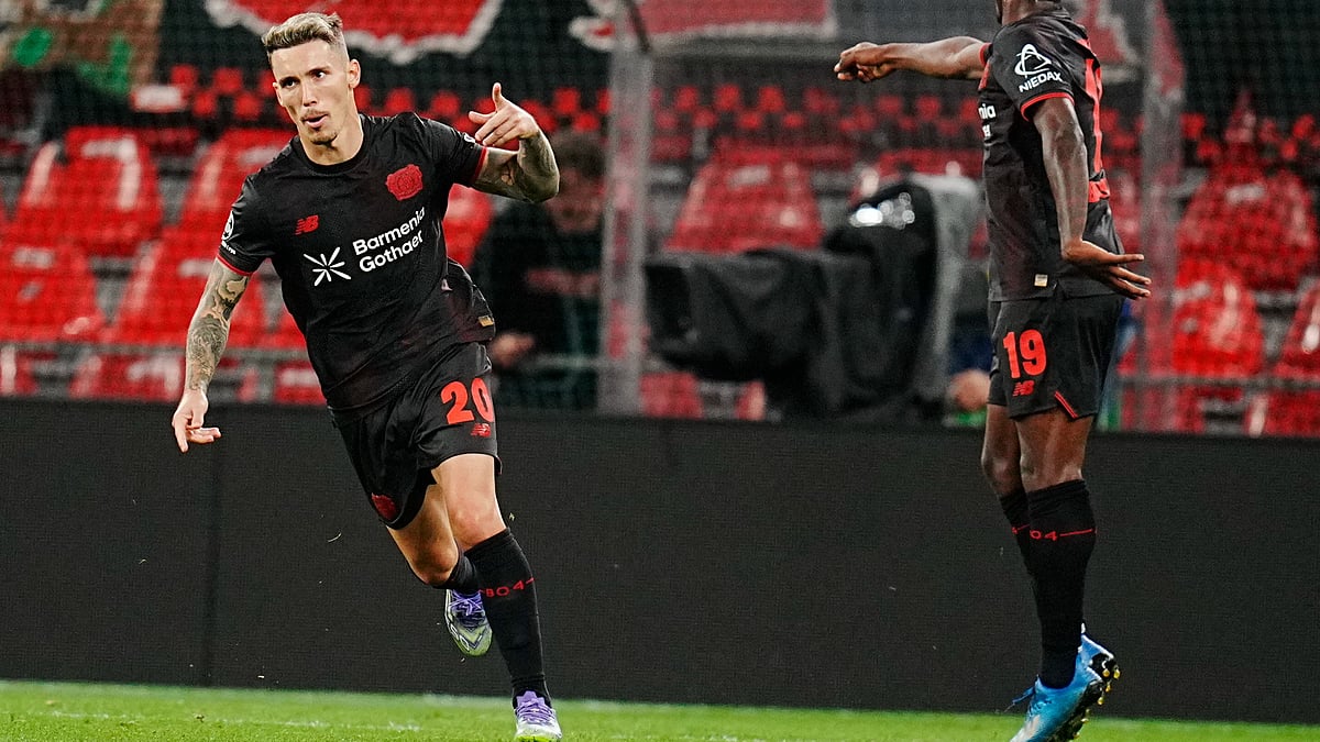 | Photo: AP/Liselotte Sabroe : Bayer Leverkusen's Alejandro Grimaldo, left, celebrates after scoring their side's first goal of the game during the UEFA Champions League first round soccer match between FC Copenhagen and Bayer 04 Leverkusen at Parken in Copenhagen, Denmark, Thursday, Sept. 18, 2025. 