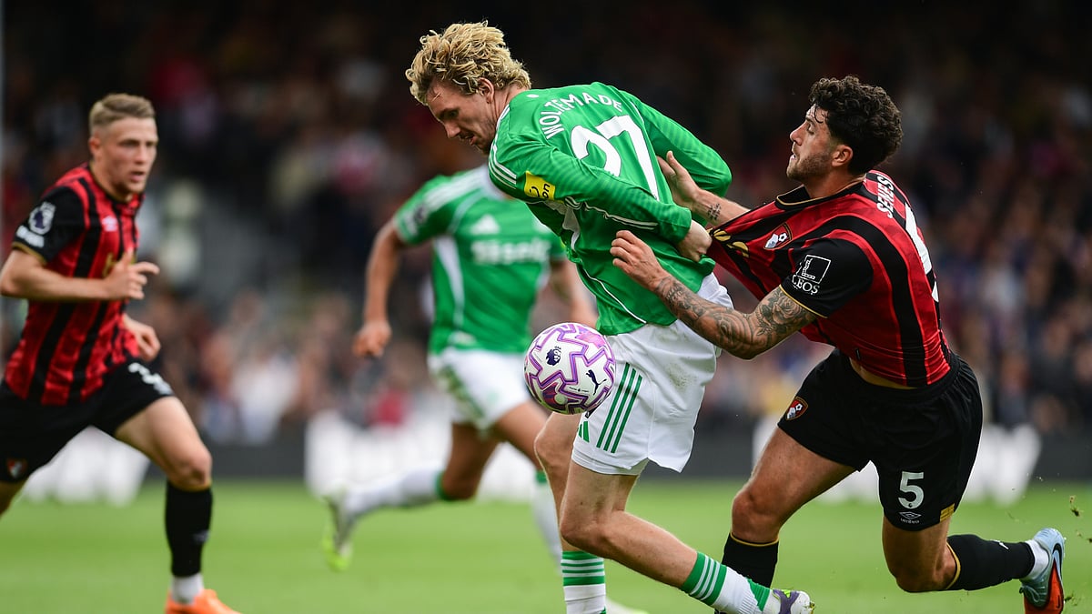 Nick Woltemade tussles with Marcos Sensei at the Vitality Stadium