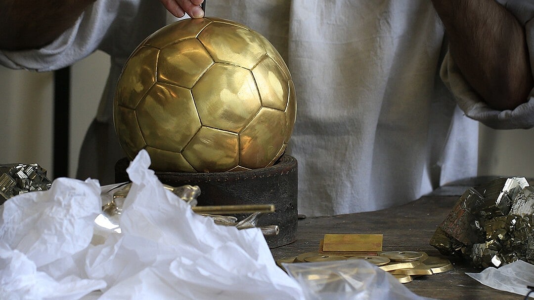 X/ballondor : The Ballon d'Or trophy in the making.