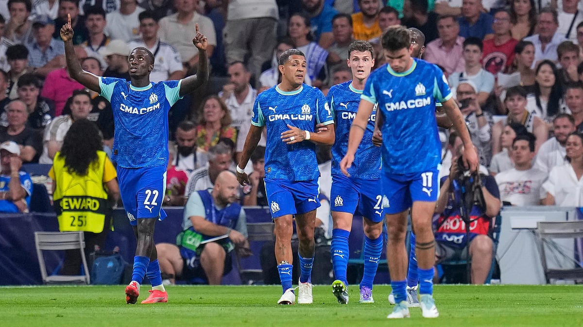 | Photo: AP/Manu Fernandez : Marseille's Timothy Weah, left, celebrates with teammates after scoring the opening goal during a Champions League opening phase soccer match between Real Madrid and Marseille at Santiago Bernabeu stadium, in Madrid, Tuesday, Sept. 16, 2025.
