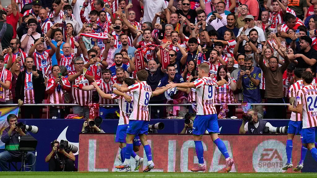 AP : Atletico Madrid players celebrate their side's third goal during the Spanish La Liga soccer match between Atletico Madrid and Real Madrid at Metropolitano stadium