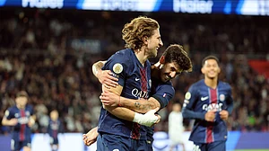 PSG defenders Illia Zabarnyi and Lucas Beraldo celebrate against Auxerre.