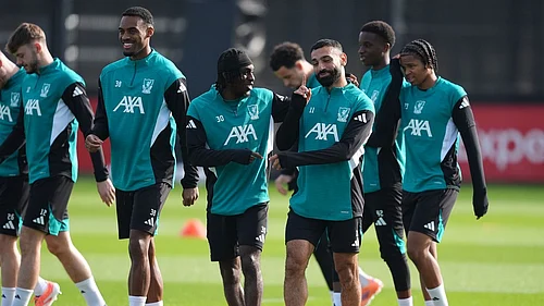 Martin Rickett/PA via AP : Liverpools Jeremie Frimpong, Mohamed Salah (right) and Ryan Gravenberch (left) during a training session in England.