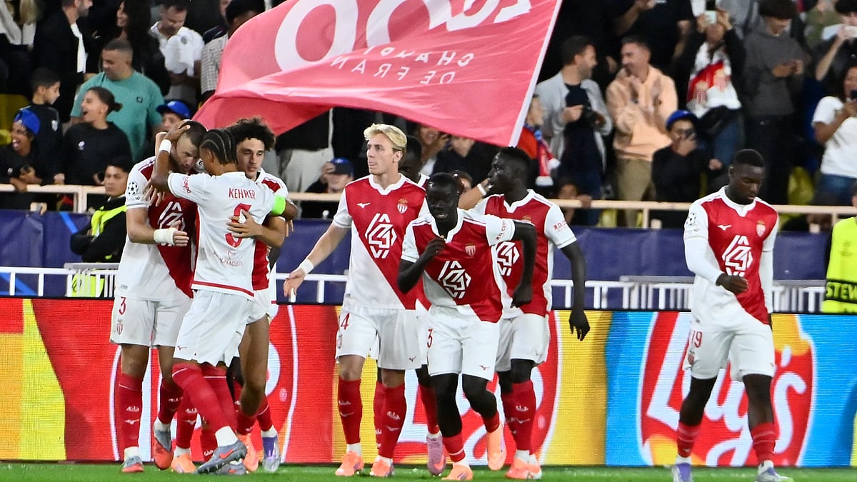 Monaco celebrate Dier's penalty