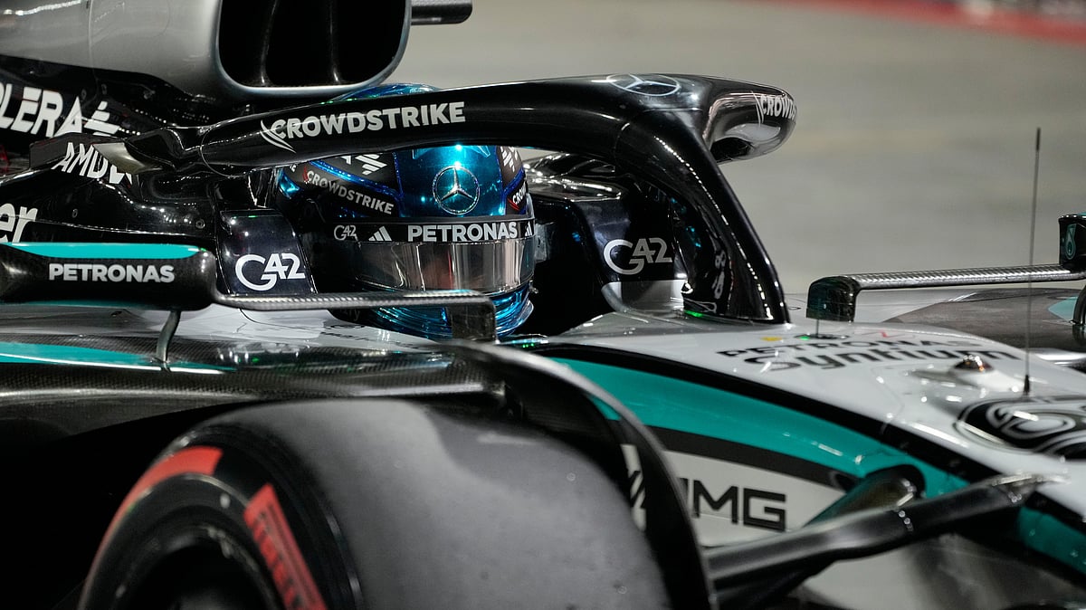 | Photo: AP/Vincent Thian : Mercedes driver George Russell of Britainenter pit lane after taking pole position during the qualifying for the Singapore Formula One Grand Prix at the Marina Bay Street Circuit in Singapore, Saturday, Oct. 4, 2025.