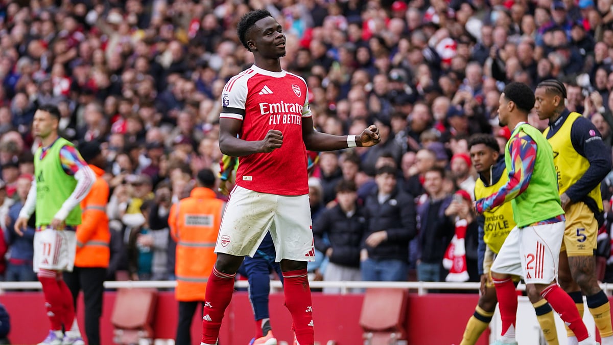 Bukayo Saka celebrates after scoring a goal for Arsenal against West Ham United.