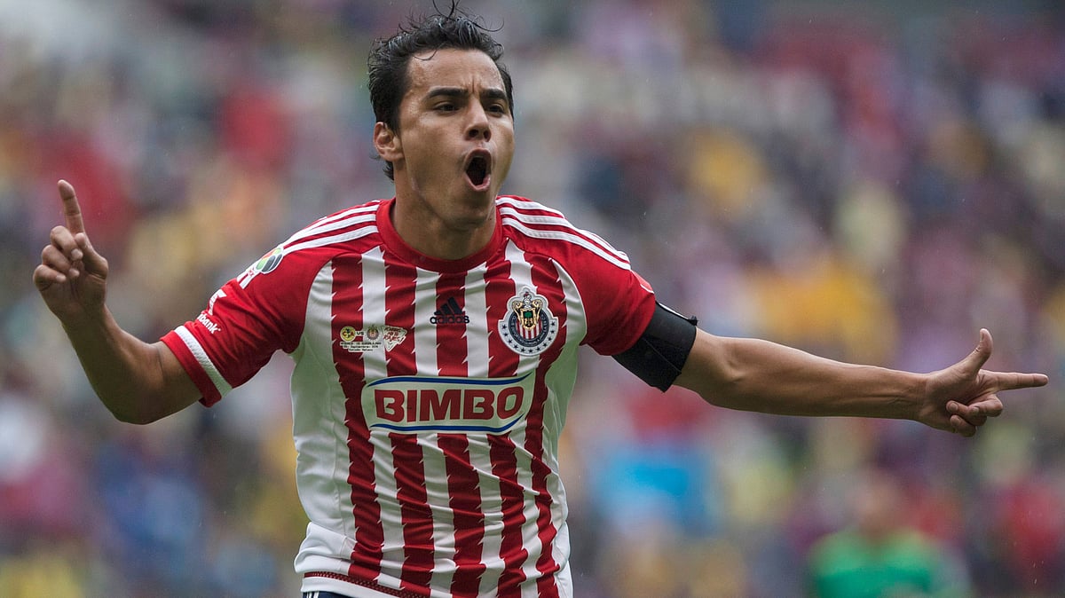| Photo: AP/Christian Palma : File photo of Chivas' Omar Bravo celebrating his goal against America during a Mexican soccer league match in Mexico City, Sept. 26, 2015.
