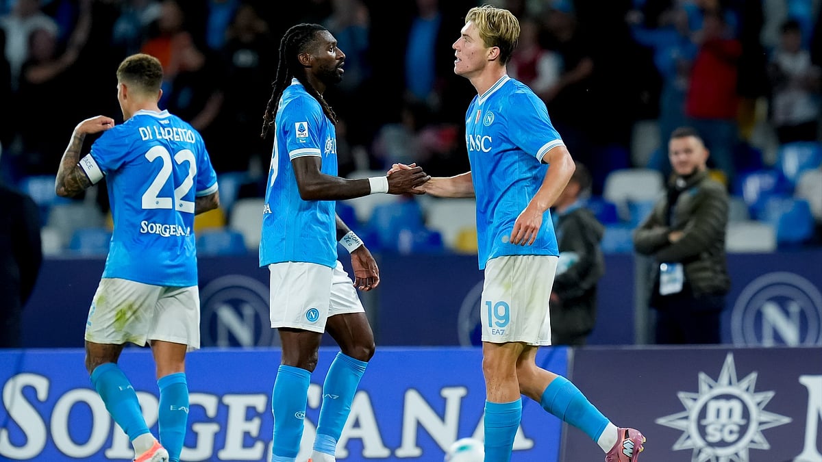 Napoli goalscorers Rasmus Hojlund and Frank Anguissa celebrate during their match against Genoa.
