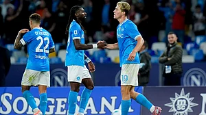 Napoli goalscorers Rasmus Hojlund and Frank Anguissa celebrate during their match against Genoa.